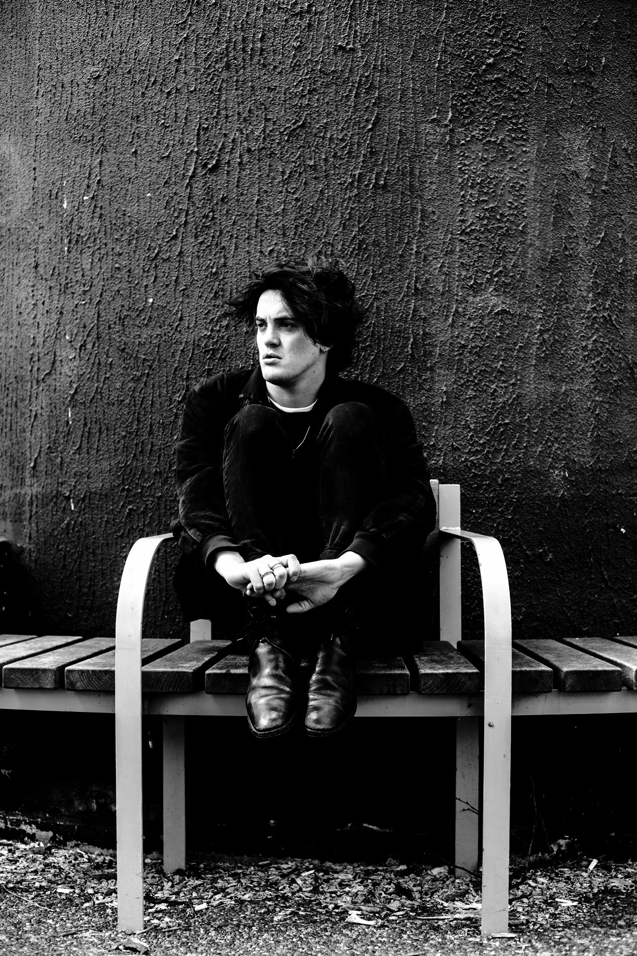 Music artist Freddie Dickson sitting on bench